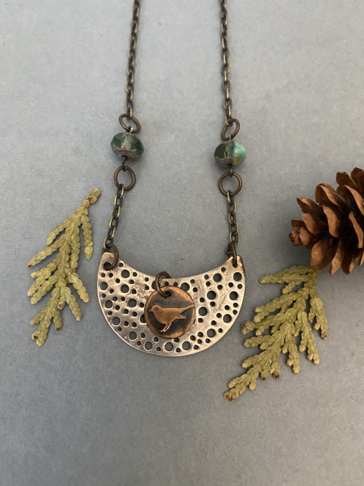 Little Bird Necklace made of copper and aluminum.