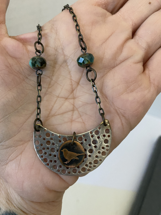 Little Bird Necklace made of copper and aluminum.