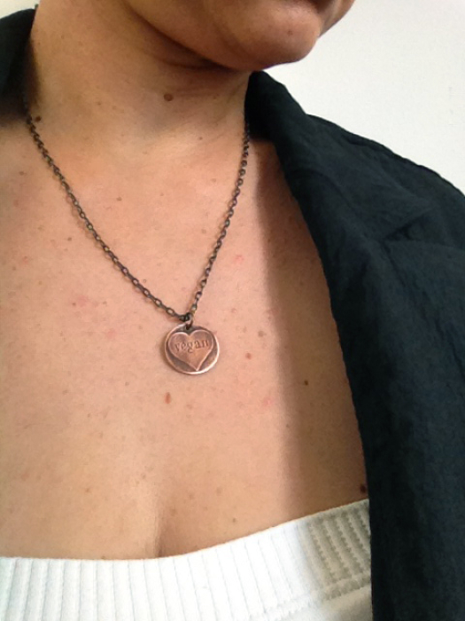 Etched Copper Vegan Heart Necklace Being Worn